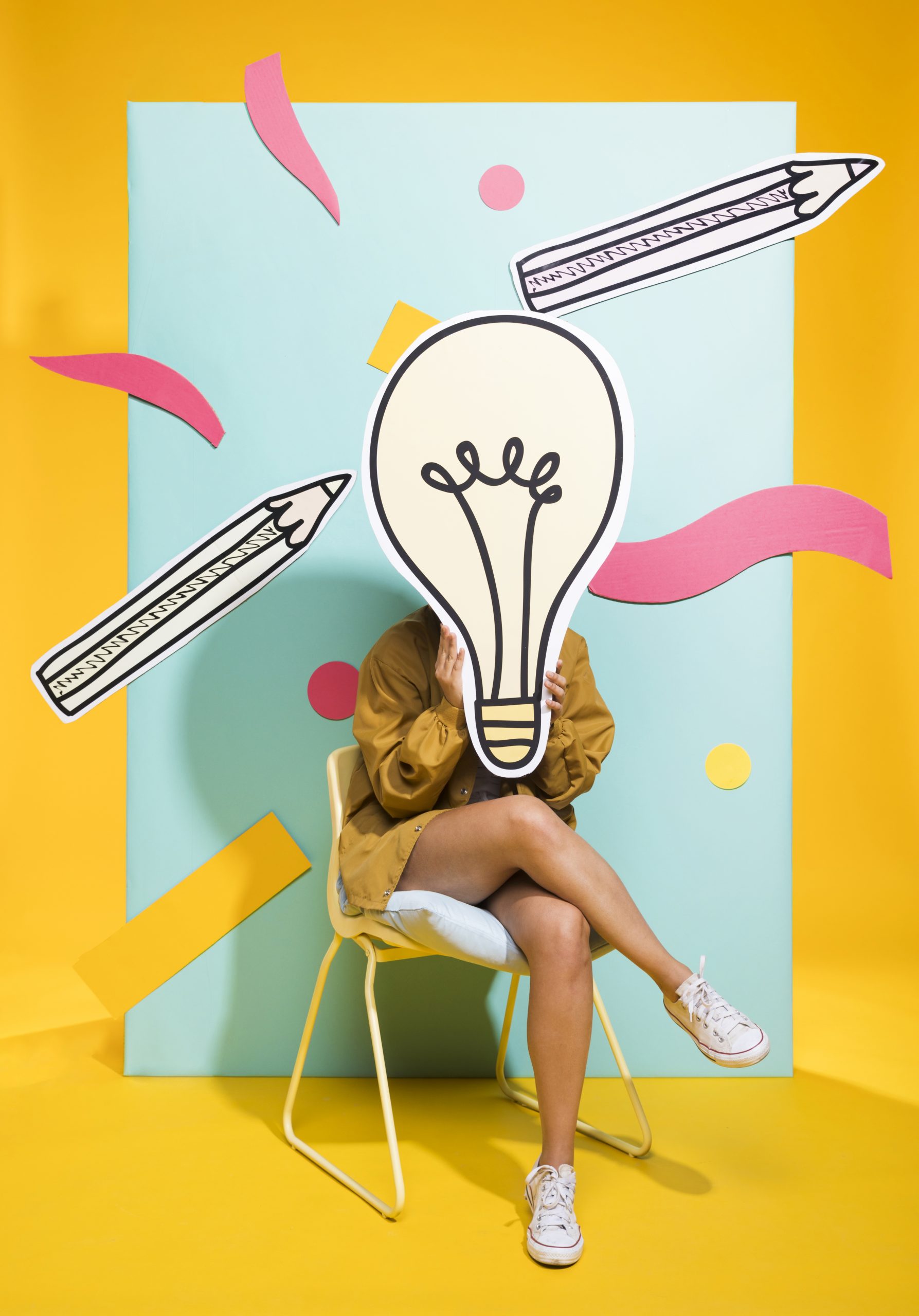portrait of schoolgirl with big light bulb scaled
